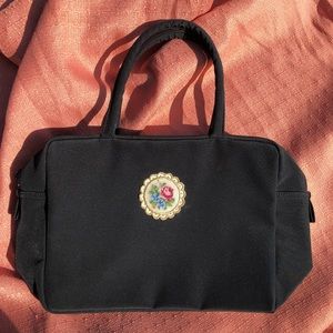 Black bag with floral embellishment